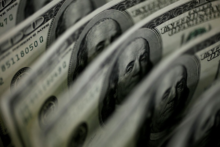 Dollar clings to gains against major currencies – Business & Finance